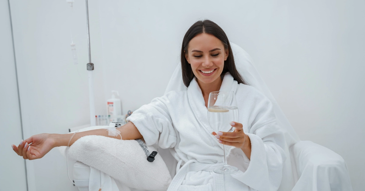 Patient comfortably seated and smiling during IV Hydration Therapy in Villa Rica, GA